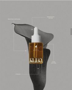 a bottle of kilo hair oil sitting on top of a black flower with information surrounding it