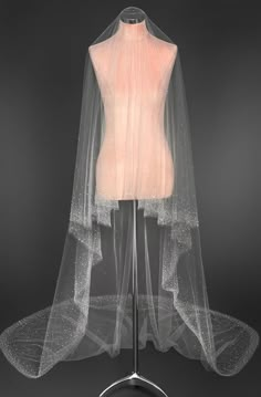 a mannequin with a veil on top of it