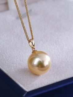 * Condition: Brand new * Center Stone: Natural Golden South Sea Pearl 9-10mm/10-11mm/11-12mm/12-13mm/13-14mm (options) * Pearl Shape Grade: Perfectly Round * Metal Purity: 18K Solid Yellow Gold * Chain Length: 45cm * Superior pearls standard - 99% of the pearl surface is clean. An extremely detailed and up-close study of the pearl is needed to find imperfections. * The item will be gift wrapped and shipped. ------------------AUTHENTICITY------------------ Authenticity is the backbone of our busi Elegant High Luster Yellow Gold Necklace, Classic Gold Necklaces With High Luster, Classic Gold Necklace With High Luster, Elegant Yellow Necklace With High Luster, Elegant Yellow Jewelry With Round Beads, Minimalist Yellow Gold Round Pearl Necklace, Elegant Yellow High Luster Necklace, Elegant Yellow Beaded Jewelry, Elegant 14k Gold Yellow Necklace