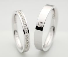 two white gold wedding rings with princess cut diamonds