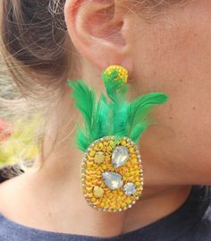 "These unique earrings are the perfect statement piece for any donut lover! Our unique, kitschy earrings feature gorgeous seed beading to look like a sprinkle donut in your choice of coloring! They also have a stunning, beaded round post. Choose your color at checkout! Measurements are approximately 2.25\"	is_active	18888049	Apparel & Accessories > Jewelry > Earrings	https://www.etsy.com/listing/810826230/beaded-donut-earrings-sprinkle-doughnut	jewelry > earrings > dangle_earring Yellow Fun Earrings For Party, Fun Yellow Party Jewelry, Fun Beaded Party Jewelry, Summer Party Beaded Jewelry, Fun Green Beaded Earrings For Party, Kitschy Earrings, Sprinkle Doughnut, Donut Earrings, Tropical Gifts