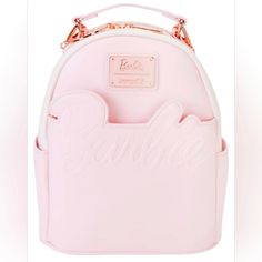 Logo Convertible Backpack, A Stunning Accessory That Seamlessly Combines Style And Versatility. The Iconic Barbie Logo In Radiant Rose Gold Adds A Touch Of Glamour To Your Look, Making A Bold Statement Wherever You Go. This Backpack Effortlessly Converts Into A Sleek Shoulder Bag, Offering Adaptability For Various Occasions. Crafted With Precision And Designed For The Fashion-Forward, It's The Perfect Companion For Those Who Seek Both Functionality And Trendsetting Elegance. Radiant Rose Gold Lo Pink Softback Backpack, Pink Backpack With Detachable Strap, Pink Backpack With Detachable Strap For Daily Use, Daily Use Pink Backpack With Detachable Strap, Pink Shoulder Backpack With Detachable Strap, Pink Leather Travel Backpack With Removable Pouch, Trendy Pink Leather Backpack, Pink School Backpack With Detachable Strap, Pink Backpack With Removable Pouch