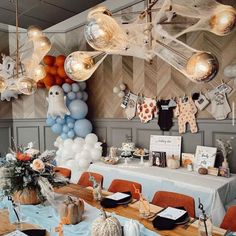 a dining room with balloons and decorations on the wall