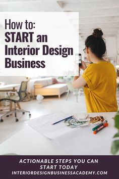 a woman sitting at a table with her cell phone in front of her and the words how to start an interior design business