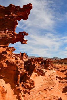 some rocks and dirt in the desert under a blue sky