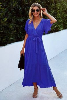 Indulge in understated luxury with our Wrapped Up Ruffle Midi Dress. Made with high-quality, 95% polyester and 5% spandex, this dress is both comfortable and elegant. The deep V-neck and ruffle detail add a touch of sophistication, while the rich royal blue color exudes exclusivity. Perfect for any occasion. Elegant V-neck Maxi Dress With Ruffle Hem, Blue V-neck Maxi Dress For Date Night, Chic Blue V-neck Midi Dress, Elegant Blue V-neck Summer Dress, Blue Solid Color V-neck Dress, Elegant Tiered V-neck Summer Dress, Elegant Tiered V-neck Dress For Summer, Royal Blue V-neck Spring Dress, Blue Ruffle Hem Maxi Dress