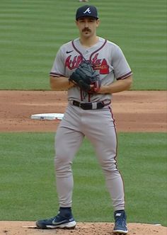 a baseball player standing on the pitchers mound