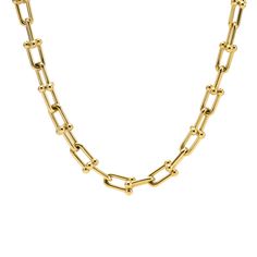 B.Tiff Horseshoe Link Chain Necklace The B.Tiff Horseshoe Link Chain Necklace is composed of smooth rounded horseshoe shape links that are balanced with carefully calculated proportion and tension and yet are weighted for a significant presence. The closure is a specially designed clasp that simulates the look of other gauge links to achieve an infinite chain look. The unisex necklace is elegant and bold that showcases the spirit of the wearer. It can stand alone by itself or be stacked with oth Timeless Gold Chain Necklace, Classic Link Chain Necklace With Chunky Chain, Classic Chunky Oval Link Chain Necklace, Classic Chunky Chain Necklace With Oval Links, Timeless Chunky Chain Link Necklace, Classic Gold Chain Link Necklace, Classic Gold Chain Necklace With Rectangular Links, Formal Chunky Chain Necklace With Oval Links, Horseshoe Necklace