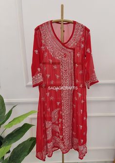 DESCRIPTION ▪ Kurti Fabric: Angarkha ▪ Kurti Length: 44-46 Inches ▪ Style: Angarkha Kurti ▪ Occasions: Party Wear, Office Wear, Festive Wear ▪ Garment Care: Hand Wash Only ▪ Price Includes: 1x Kurti with inner Red Kurta With Resham Embroidery For Transitional Season, Red Resham Embroidered Kurta For Transitional Season, Red Kaftan With Dupatta For Festivals, Festive Red Kaftan With Dupatta, Traditional V-neck Kurta With Chikankari Embroidery, Red Churidar With Dabka Work For Transitional Season, Traditional Georgette Kaftan With Dupatta, Designer Red Kaftan For Navratri, Red Designer Kaftan For Navratri