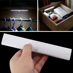 the motion sensor light is being held by a person's hand and in front of an open drawer