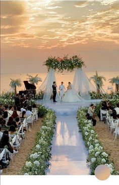 a wedding ceremony on the beach at sunset