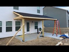 a house that is being built with some wood