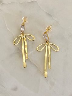 For all the bow lovers🎀 Material: 16k gold plated on brass 14k Gold Bow Jewelry, Elegant Gold Jewelry With Butterfly Knot, Gold Wedding Jewelry With Butterfly Knot Detail, Gold Earrings With Decorative Bow As Gift, Metal Bow Earrings For Gifts, Elegant Gold Jewelry With Ribbon, Formal Gold Jewelry With Bow, Chic Gold Earrings With Decorative Bow, Chic Gold Earrings With Bow