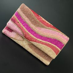 Hi ladies, these beautiful clutch bags will make you fall in love with the colors and design.  Carry with your matching dresses and wait for a million compliments. Shades of Pink and gold, add to the whole look and the craftsmanship is topnotch.   Clutches come with detachable string, which you can add if you like and it is amazing without it too.  The size of this clutch is 9x6inch and the rear size is a comfortable cotton fabric so that it is easy to carry it with your dresses. This can be an amazing gift this Thanksgiving, Christmas, and New Year.  A gift wrap option is also available and we will love to pack it for your loved ones! For the first time, we are adding an amazing collection of clutches to our store, all handmade with love in India. Pink Beaded Clutch Evening Bag, Handmade Pink Evening Bag For Party, Handmade Pink Evening Bag For Events, Pink Beaded Rectangular Clutch, Pink Rectangular Beaded Clutch, Chic Pink Party Clutch, Rectangular Pink Beaded Clutch, Multicolor Pouch Clutch For Party, Handmade Pink Clutch For Evening