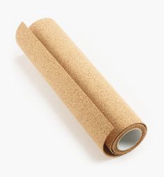 a roll of cork paper on a white background with clippings to the side