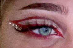 Makeup Ideas With Red Eyeliner, Red Eyeliner With Gems, Eyeliner And Gems Makeup, Red Eye Makeup Gems, Red Graphic Makeup Looks, Red Inspo Makeup, Hot Red Makeup Look, Red Devil Halloween Makeup, Red Makeup Rhinestones