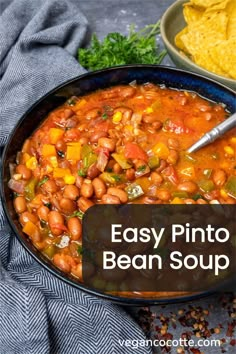 an easy pinto bean soup in a bowl with tortilla chips on the side