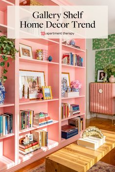 a pink bookcase filled with lots of books