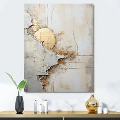 an abstract painting with gold paint on the wall