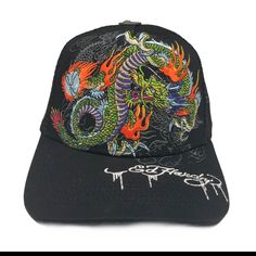 Ed Hardy Embroidered Japan Dragon Trucker Hat Color: Black Style# Ehh0001-20 Printed And Embroidered Logos One Size Fits Most Adults Front Panel: 100% Cotton Back Panel 100% Polyester Sunshade Back 76% Cotton, 17% Rayon, 7% Polyester Made In China Black Visor Hat With Embroidered Logo, Black Casual Hat For Festivals, Black Casual Festival Hat, Black Baseball Cap With Embroidered Logo And Short Brim, Trendy Black Trucker Hat With Embroidered Logo, Black Embroidered Snapback Hat, Black Short-brimmed Baseball Cap With Embroidered Logo, Black Hat With Embroidered Logo And Short Brim, Embroidered Black Baseball Cap