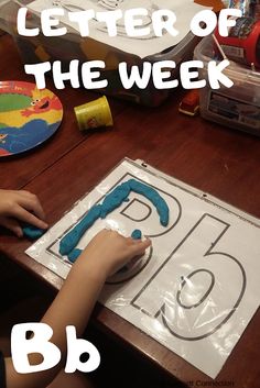 a child is making a letter of the week b