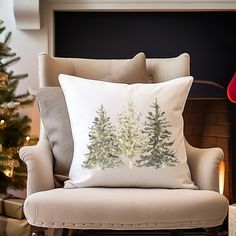 a christmas tree pillow sitting on top of a chair in front of a fire place