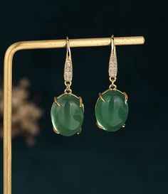 Handmade Genuine Green Jade Donut Earrings,18K Gold Plated Jade Earrings, Burmese Jade Earrings,Jade Dangle Earrings,Gift For Women Pendant Material: Hetian Jade The Hetian jade is the meaning of holding back peace and keep happiness. The natural Hetian jade can let your skin become smooth and good for your health. Notice: All the products are photographed under natural light, and what you see is the real thing. However, due to different monitors and other reasons, the color you see in the picture may be a little different compared with the real thing. Due to different measuring instruments. The product may have an error of 1-2 cm, please understand. Since we are purely handmade, there may be measurement errors in the measurement process. If you want an accurate size, please contact us or Green Jade Earrings, Jade Earrings Drop, Donut Earrings, Donuts Earrings, Burmese Jade, Hetian Jade, Women Pendant, Jade Earrings, Natural Jade