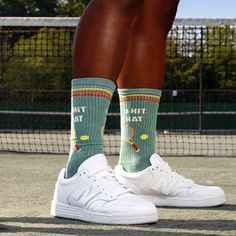 Wanna know how to score style points on and off the court? Put on these tennis-themed socks with a fun and bold graphic of a tennis racket and ball, with the cheeky words "I'd Hit That." They're the perfect quirky accessory to show off your love for the sport or just make a statement. Plus, the green and multicolored stripes add a pop of color to your feet. So, the next time you hit the court or just want to add some fun to your outfit, reach for these "I'd Hit That" socks and prepare to ace you Mens Sports Socks, Tennis Socks, Sock Lovers, Coffee And Donuts, Mens Crew Socks, Men's Shoe, Next Fashion, Sports Socks, Funny Socks