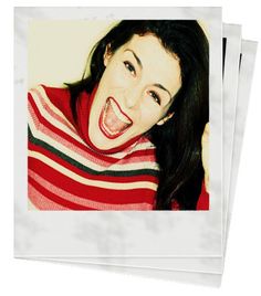 a woman making a funny face with her mouth wide open while wearing a red and white striped sweater