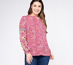 A bright and cheery floral print covers this button-front blouse, making it the perfect pick for weekend outings or hitting up happy hour after a long day at the office. From Belle Boho by Kim Gravel. Casual Vibrant Print Tops For Work, Casual Workwear Tops With Vibrant Print, Pink V-neck Peasant Top With Floral Print, Bohemian Long Sleeve Blouse With Ditsy Floral Print, Bohemian Long Sleeve Tops With Ditsy Floral Print, Pink Floral Print Long Sleeve Peasant Top, Pink Long Sleeve Peasant Top With Floral Print, Long Sleeve Floral Print Peasant Top, Casual Long Sleeve Peasant Top With Floral Print