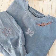 Adults sweatshirt includes your team name embroidered on the neckline. With or without stars. A name, team, star, or mascot* can be added to the sleeve. Sweatshirt is comfort colors brand. If interested in the vintage distressed, there is a separate listing for a sweatshirt with the vintage stitching and distressing. (Kids matching sweatshirts available upon request) *not all mascots or logos will be available LOCAL customers: if you'd like to pickup, please message me for a custom listing with Team Sweatshirts, Matching Sweatshirts, Team Name, Team Names, Embroidered Sweatshirts, The Vintage, Comfort Colors, Basketball, Soccer