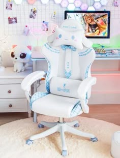 a white office chair sitting on top of a rug in front of a computer desk