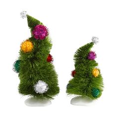 two small christmas trees made out of fake grass and pom poms on top of each other