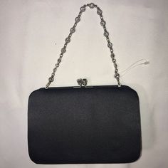 Gorgeous Evening Bag! Beautiful Rhinestone Chain! Classy & Elegant! Does Have Spot On One Side That Needs Cleaned. Retails $58! In Great Condition! No Rips, Stains Or Tears! Smoke Free, Pet Free Home! Black Formal Bag, Black And Silver Clutch, Black Rectangular Evening Bag With Silver-tone Hardware, Black Clutch With Silver-tone Hardware For Party, Black Evening Bag With Silver-tone Hardware, Black Bags With Silver-tone Hardware, Black Bags With Silver-tone Hardware For Events, Black Bags For Events With Silver-tone Hardware, Elegant Black Clutch With Silver-tone Hardware