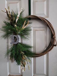 a wreath is hanging on the front door