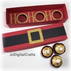 some chocolates are sitting next to a red box that says hohohoo