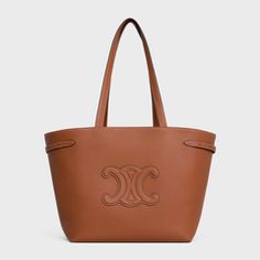 LARGE VOYAGE BAG IN TRIOMPHE CANVAS WITH CELINE PRINT - TAN | CELINE Celine Cabas, Cuir Triomphe, Celine Tote Bag, Celine Tote, Aging Beautifully, Fragrance Collection, Celine Bags, New Fragrances, Dog Accessories