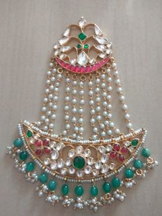 *It's Handmade Kundan Jhoomer/)Passa Mangtikka for Indian and Pakistani Brides. *It's made from Silver n Copper with White/pink Kundan Stones Settings with green n pearl hangings and 22k gold Plating as shown in picture. *Our all jewelry is made from semiprecious stones and beads. *WARRANTY: ITS GENUINE HANDMADE JEWELRY AND WE ARE GIVING LONG LIFE WARRANTY FOR OUR ALL ITEMS. All of our Kundan Jewelry is 100% handmade with ancient Kundan stone setting method using silver foils. It is one of the m Heavy Bollywood Dupatta For Diwali, Kundan Tikka With Stone Work For Festivals, Heavy Kundan Tikka For Diwali, Bollywood Stone Work Tikka For Festivals, Traditional Stone Work Tikka For Navratri, Bollywood Style Stone Work Tikka For Festivals, Heavy Bollywood Dupatta For Eid, Traditional Green Heavy Tikka, Bollywood Style Heavy Dupatta For Eid