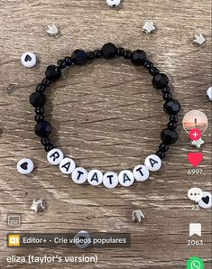 a bracelet with the word papaata written on it and other items around it, including beads