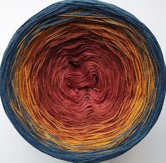 a yarn ball with red, yellow and blue colors