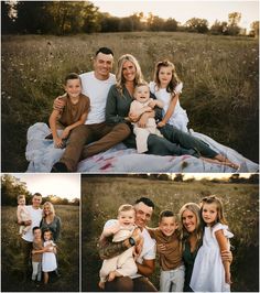 a family sitting on a blanket in the middle of a field