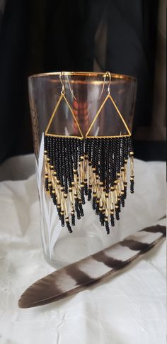 The romance between black and gold is timeless. Sparkling gold bugle beads shine brightly against a semi matte black backdrop. Pops of matte gold flank their boldness. Woven onto gold plated triangles and finished with 14k gold filled ear wires. Made to order. Handwoven Earrings, Black Backdrop, Earrings Classic, Black Backdrops, Ear Candy, Bugle Beads, Beading Wire, Colorful Earrings, Seed Bead Earrings