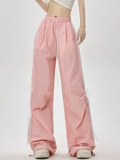 𝔇𝔢𝔱𝔞𝔦𝔩𝔰: Style: Casual, Streetwear, Bloke core Materials: Spandex Quantity: 1 pc These lightweight pants are designed in a pastel color scheme, ideal for the summer season. The ribbon accents add a touch of femininity to this casual piece, perfect for a laid-back yet fashionable outfit. Enjoy free shipping with a purchase of over 80$ SIZE LENGTH WAIST HIPS 39 in 25 in 50 in M 41 in 26 in 51 in L 41 in 27 in 52 in XL 42 in 28 in 53 in Item measured by hands may have 1-2 in differences.SIZE LENGTH WAIST HIPS 102 cm 60 cm 123 cm M 103 cm 64 cm 127 cm L 104 cm 68 cm 131 cm XL 106 cm 72cm 135cm Item measured by hands may have 2-3 cm differences. Summer Nylon Drawstring Pants, Pink Summer Streetwear Pants, Trendy Pink Drawstring Pants, Spring Nylon Pink Pants, Pink Parachute Pants For Streetwear, Pink Parachute Pants With Pockets For Summer, Casual Pink Nylon Pants, Summer Wide Leg Nylon Parachute Pants, Spring Pink Nylon Bottoms