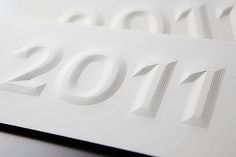 a white paper with the numbers 2011 printed on it's back and bottom half