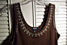 "Bejeweled tank top by Donna Karan. Brown cotton tank for a suit or spring and summer wear with shorts. Size medium. Stretches some. Bust measures 34\" or more. Length 25\". Trim is silver embroidery with rhinestones. No flaws of any kind. Stored with TLC. Comes from a smoke-free home." Spring Stretch Embellished Tank Top, Spring Embellished Stretch Tank Top, Summer Sequined Cotton Tops, Summer Cotton Tops With Sequins, Cotton Sequin Tops For Summer, Embellished Fitted Casual Tank Top, Casual Embellished Fitted Tank Top, Casual Embellished Tank Top, Embellished Spring Tank Top