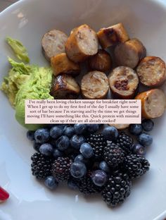 a white bowl filled with different types of fruits and veggies next to a piece of paper