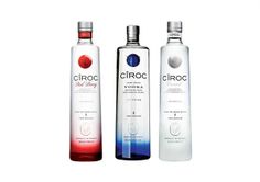 three bottles of vodka with different flavors