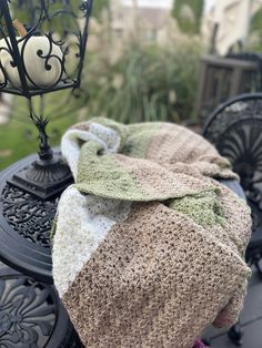 a blanket is laying on top of an iron table