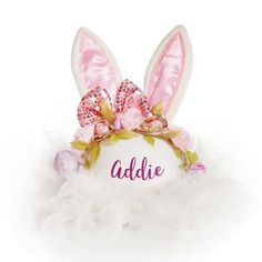 Shop our Personalised Pink Bow Easter Hat - a beautiful and unique hat that will have your little one feeling like the star of the show. The Personalised Pink Bow Easter Hat uses a white felt hat as the base and features white and pink sequin ears, a pink sequin bow, and gorgeous metallic gold with soft pink florals. Also available in a matching Personalised Pink Bow Easter Headband (sold separately) - ideal for a sibling or best friend. The hat is lovingly created, personalised by hand and made Whimsical White Hat For Birthday, Playful White Party Hat, Whimsical White Mini Hat For Gifts, Playful White Mini Hats For Gifts, Whimsical White Mini Hat As Gift, White Playful Mini Hats As Gift, Whimsical White Hat For Parties, White Novelty Party Hat, Novelty White Mini Hat With Curved Brim