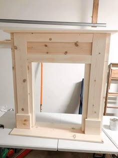 an unfinished fireplace is being built in a workshop